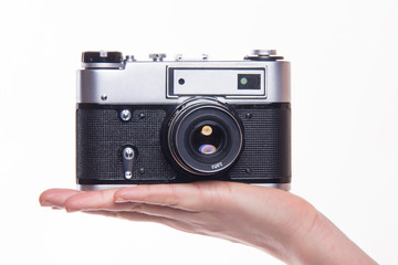 Classic 35mm photo camera on hand