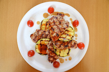 pork tenderloin with zucchini and sauce demi-glace