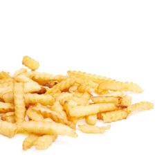 Pile of multiple wavy french fries isolated