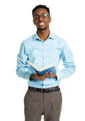 Happy african american college student with book in his hands st