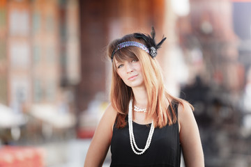 Flapper girl woman in1920s style portrait outdoor