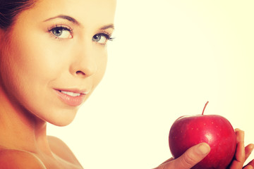 Beautiful woman holding an apple