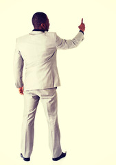 African businessman standing back