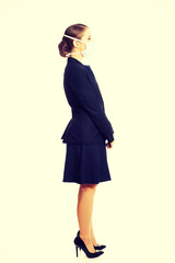 Fototapeta premium Businesswoman with protecting mask