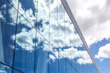 Fototapeta na wymiar Clouds reflected in the glass Opera House, Oslo, Norway