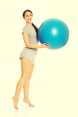 Woman holding fitness ball