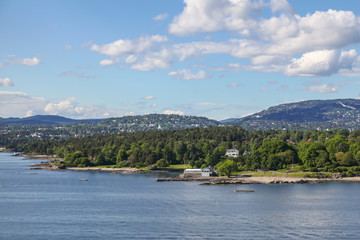 Fototapeta na wymiar Cottages on the shore of the Oslo Fjord, Norway