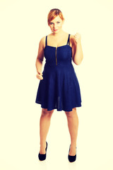 Overweight woman with her fists up