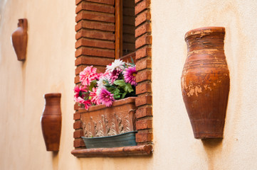 Architectural elements in the wall of a house in Castelmola