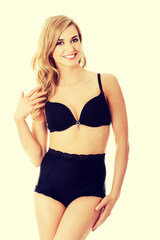 Naklejka premium Happy young woman in lingerie