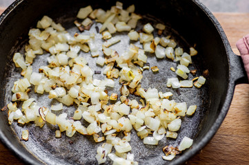 Fried onions in a frying pan