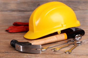 Construction tools with helmet on table close up