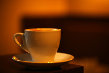 Cup of coffee on table in cafe