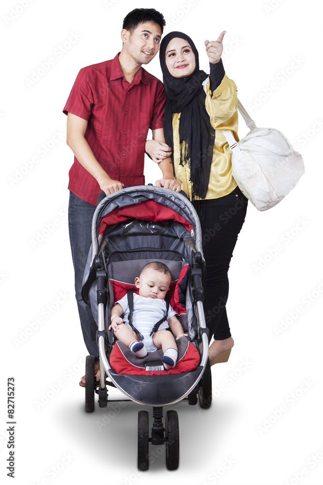 Wall mural two parents with baby in the stroller