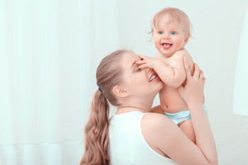 Young mother holding her baby