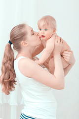 Young mother holding her baby