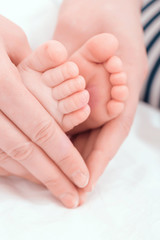 Obraz na płótnie Canvas Feet of a little baby 
