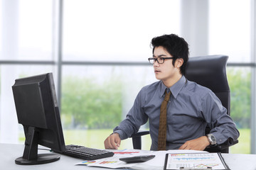 Shocked entrepreneur working near the window