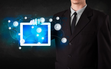 Young person holding talbet with communication technology concep