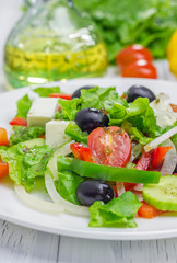 Greek salad on a white plate closeup