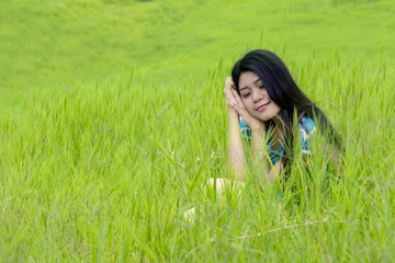 Lovely woman daydreaming at field