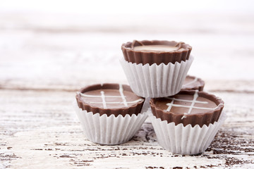 Dark chocolate on wooden background
