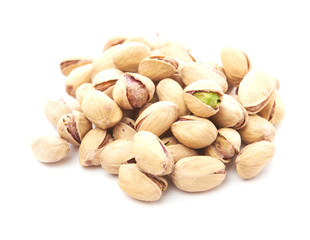 Heap of pistachios nuts isolated on the white