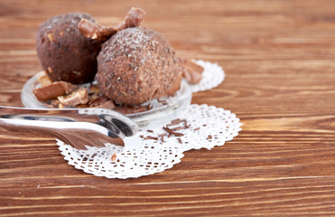 Cupcake with chocolate on wooden background