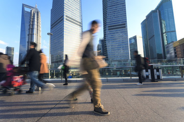 Modern city Shanghai and pedestrians