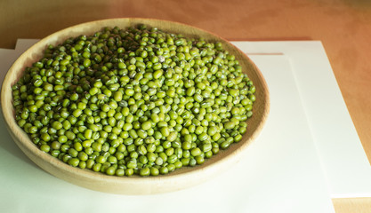 the mung beans on wooden table