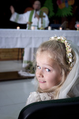 Girl in holy communion dress and veil