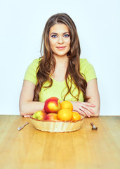 Healthy life style portrait of young woman with fruit