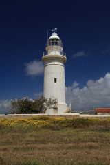 Fototapeta na wymiar Beautiful old lighthouse in Cyprus Archaeological Park 