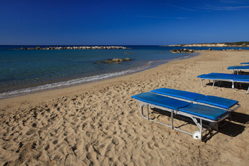 Coral Bay beach and lounge chairs in Cyprus