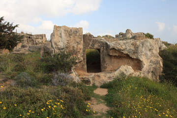 Overgrown with grass ruins to the Tombs of the Kings Paphos. Cyprus
