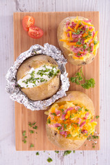 board with assorted of baked potato