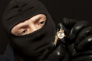 Thief with a golden watch