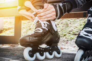 dressing roller skates for skating - obrazy, fototapety, plakaty