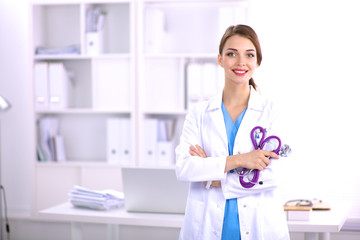 Medical team sitting at the table in modern hospital