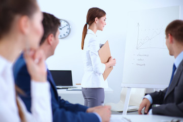 Fototapeta premium Successful business man standing with his staff in office