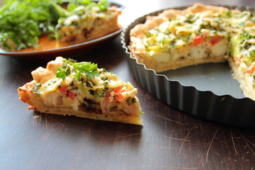 Piece of vegetable pie with broccoli, cheese and parsley