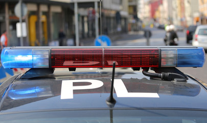 flashing sirens of police car during the roadblock in the city