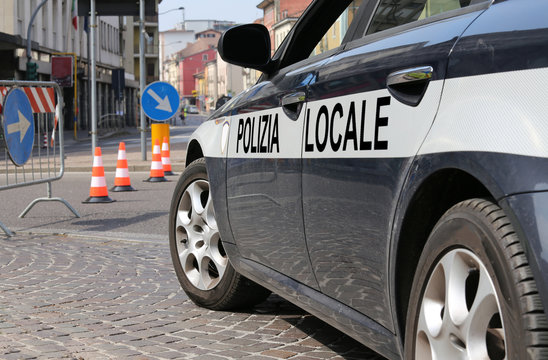 italian police car during the roadblock in the street