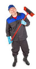 Worker sweeping floor.