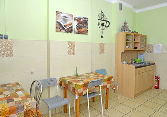 Interior of a kitchen-dining room in small hotel
