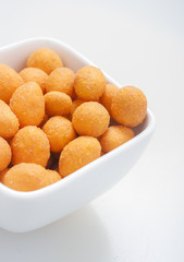 Spiced coated fried peanut.