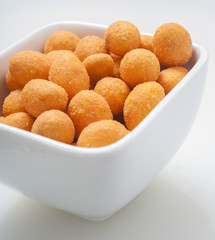 Spiced coated fried peanut.