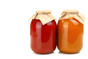 Tomato and carrot juice in a bottle of glass isolated