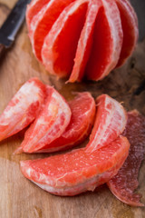 Grapegruit pieces on the kitchen board