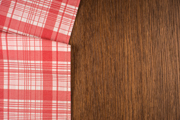 the checkered tablecloth on wooden table